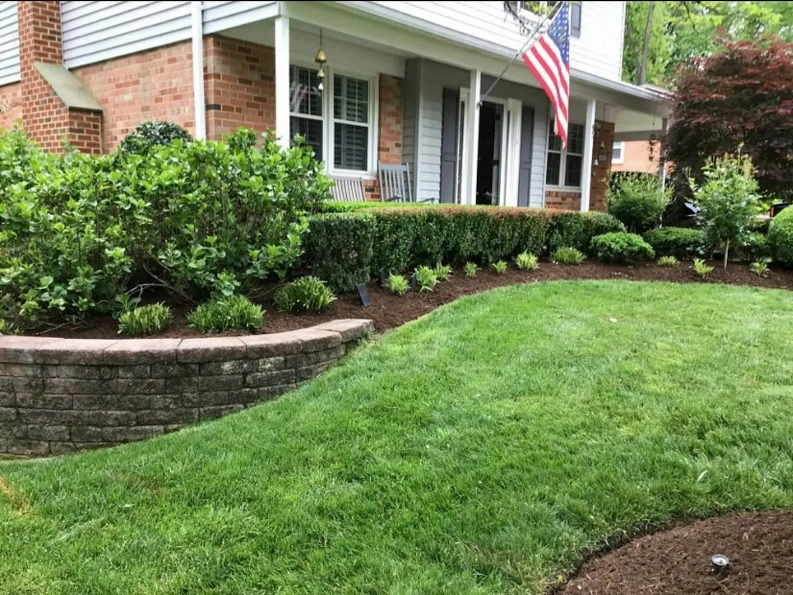 A manicured lawn in front of a Milford home